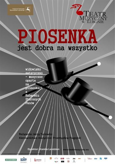 szare tło, w rogu logo teatru muzycznego w lublinie , na środku dwa czarne kapelusze i napis piosenka jest dobra na wszystko
