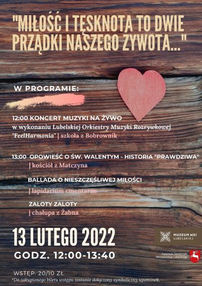 Plakat promujący wydarzenie koncertu Walentynkowego, znajduje się na nim zdjęcie deski z połozonym na nim wyciętym z papieru sercem a na środku jest nałozony tekst informujący o programie wydarzenia