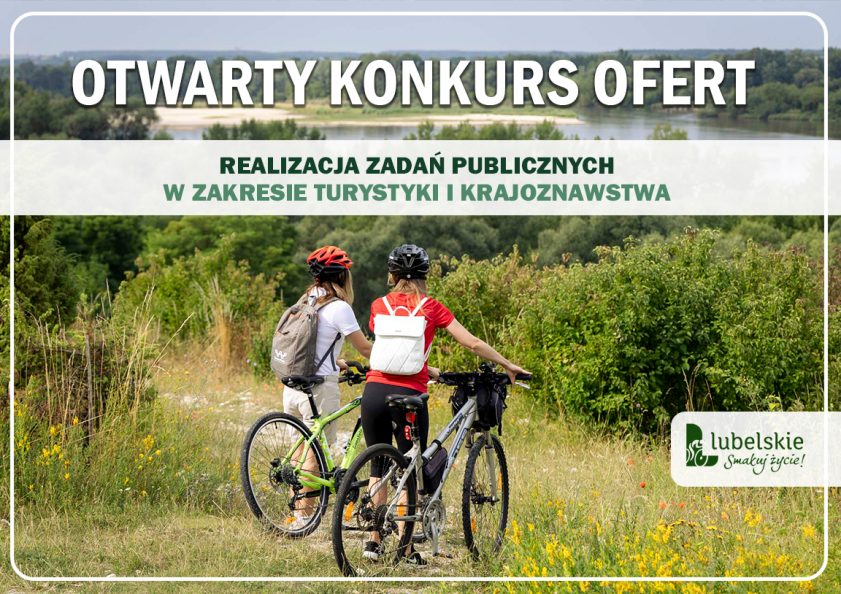 dwie osoby z rowerami, w tle rzeka Wisła